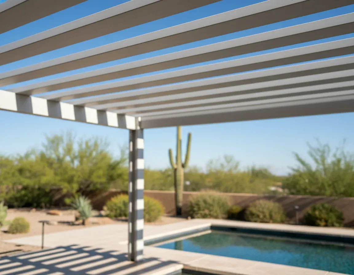 Aluminum pergola with clean lines beside a Tucson pool deck
